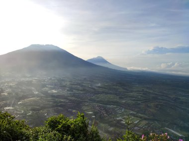 view from the hill. see the beauty of nature from the top of the hill. aerial view. sea of clouds from the top of the mountain. Mountain background and clear blue sky in the morning.