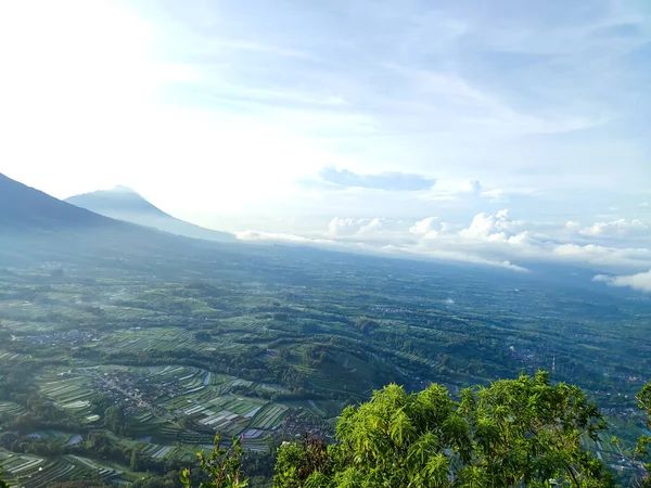 view from the hill. see the beauty of nature from the top of the hill. aerial view. sea of clouds from the top of the mountain. Mountain background and clear blue sky in the morning.