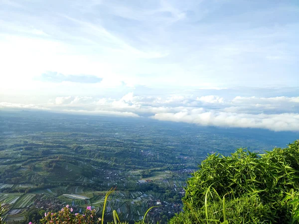 view from the hill. see the beauty of nature from the top of the hill. aerial view. sea of clouds from the top of the mountain. Mountain background and clear blue sky in the morning.