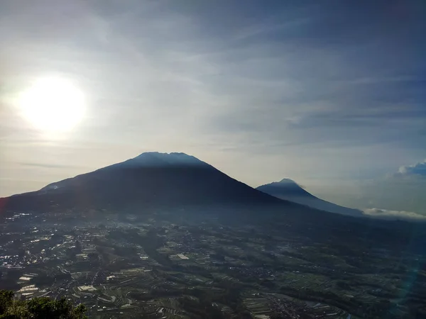 view from the hill. see the beauty of nature from the top of the hill. aerial view. sea of clouds from the top of the mountain. Mountain background and clear blue sky in the morning.
