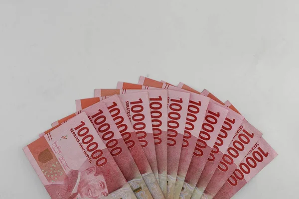 Indonesian rupiah currency. close up One hundred thousand rupiah. 100000 rupiahs. with isolated concept, studio photography. white background.