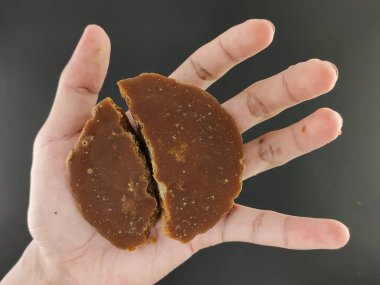 Palm sugar. coconut sugar or palm sugar, kitchen seasoning sweet taste enhancer. seen from above.