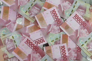 Indonesian rupiah currency. close up One hundred thousand rupiah. 100000 rupiahs. with isolated concept, studio photography. white background.