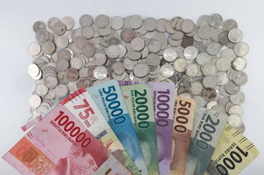 order of the Indonesian rupiah currency from smallest to largest. Banknotes 100000, 75000, 50000, 20000, 10000, 5000, 2000, 1000 rupiah. with full framing concept. isolated studio photography