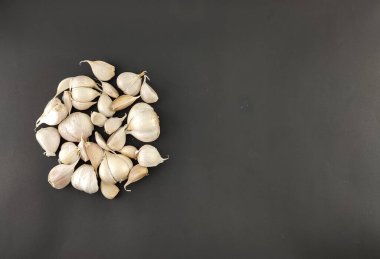 close up, garlic. herbs or spices. the main seasoning in cooking. flavor enhancer. with isolated concept, photography studio.