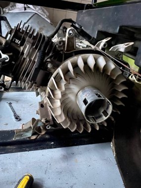 The gasoline generator engine disassembled is visible rabbit close-up