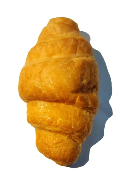 Egy Croissant Feküdt Fehér Háttér — Stock Fotó