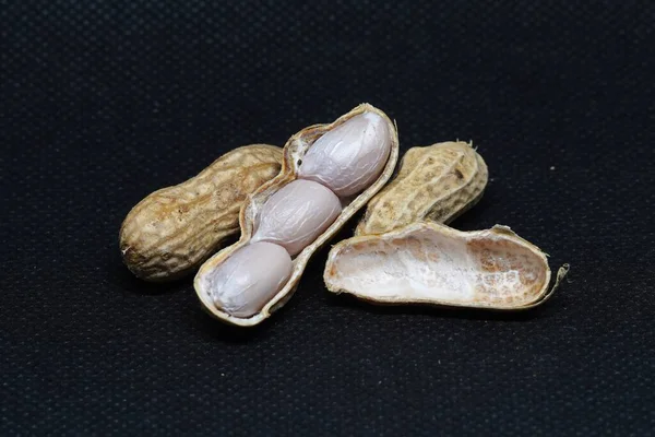 Preto Foto Fundo Amendoins Descascados Descascados Empilhados Juntos — Fotografia de Stock