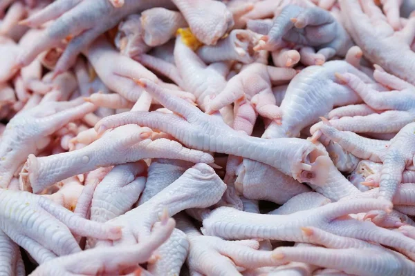 chicken feet stacked together for sale