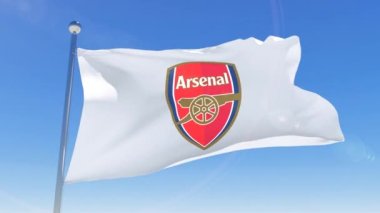 Arsenal Futbol Kulübü 'nün bayrağı arka planda izole bir şekilde sallanıyor. Arsenal F.C. Profesyonel bir futbol kulübü. 