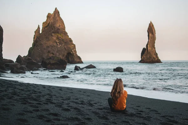 Blond Woman Walking on Black Beach in Iceland, Atlantic Ocean, Sunny Day, Reynisdrangar