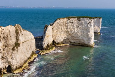 Old Harry Rocks, located at Handfast Point on the Isle of Purbeck in Dorset, England. They are chalk formations which form part of the Jurassic Coast.
