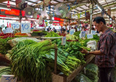 Bangkok, Thailand - 21 March, 2019: An array of fruits and vegetables on display at the Khlong Toei market, the biggest fresh market in Bangkok, Thailand.