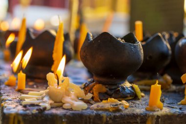Candles at the Wat Phra Singh in Chiang Mai, Thailand.