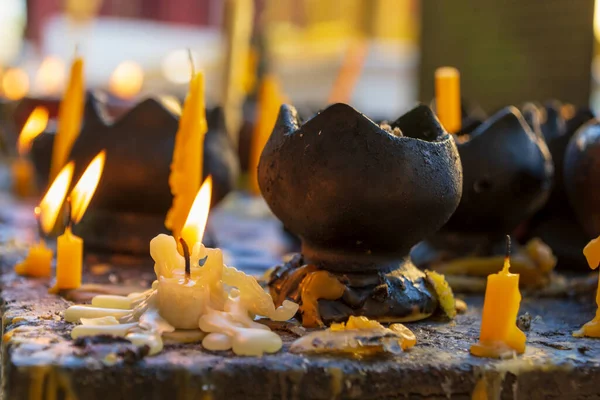 Candles at the Wat Phra Singh in Chiang Mai, Thailand.