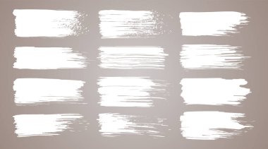 Boya fırçası seti. Beyaz mürekkep grunge fırça darbeleri. Grunge tasarım elementleri. Boyalı mürekkep çizgileri. Yaratıcı izole yerler. Mürekkep lekesi, soyut şekil lekeleri ve karalama seti.