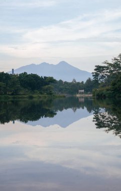 a beautiful landscape in the morning with mountain and lake