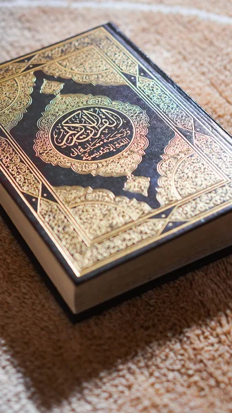 The Holy Al Quran with written Arabic calligraphy. The holy book of Muslims.