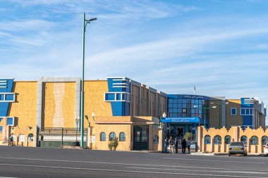 Beni Ounif, Bechar, Algeria - December 26, 2022: Hospital building with arabic panel says 