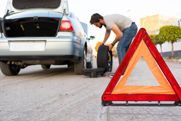 preventing accidents using a hazard triangle on the road