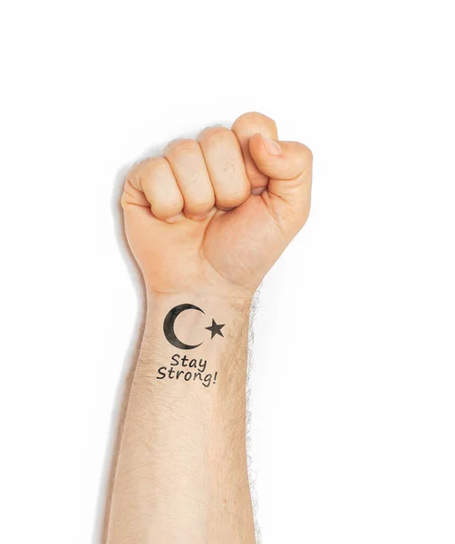 hand of a young caucasian man making a gesture of support and strength