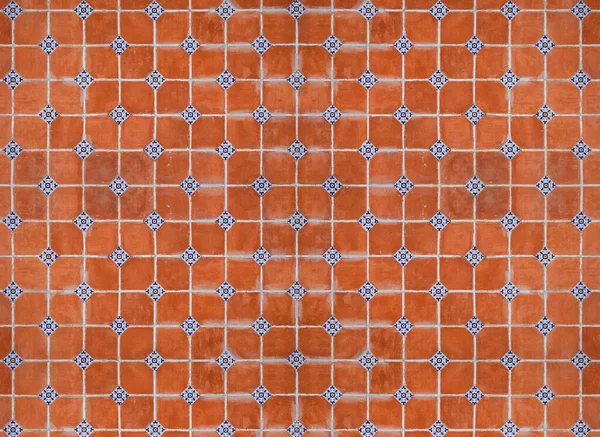 traditional mexican red wall with adornments of handmade hand painted talavera poblana tiles in Atlixco, Puebla, Mexico