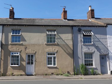 Exterior view of old terraced houses on a street in an English town