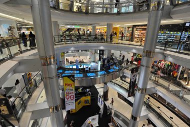 The interior of Siam Discovery shopping mall is seen as shoppers browse stores on June 30, 2013 in Bangkok, Thailand. The mall is in the Thai capital's shopping and commercial district. clipart