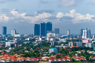 Residential buildings in the city are surrounded by commercial buildings in the evening.