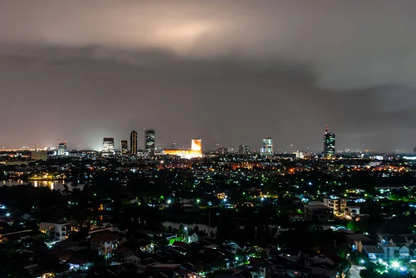 Rain in the city at night in Bangkok, Thailand