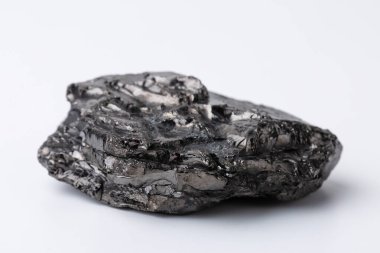 Natural black fossil coal on a white isolated background.
