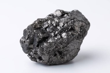 Natural black fossil coal on a white isolated background.