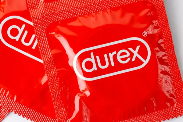 stock image A picture of a red condom package of the brand Durex.