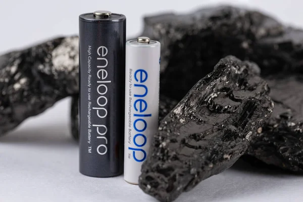 stock image Panasonic eneloop ecological battery in pure black coal.