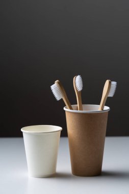 Toothbrush in a cardboard ecological cardboard cup, hygiene health care.
