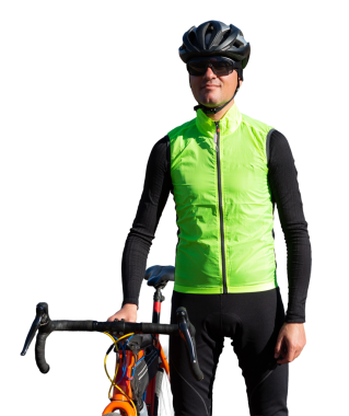 Cyclist riding bicycle on road against clear sky. A man in an outfit stands with a bicycle on an autumn sunny day.