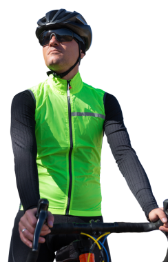 A man in clothes stands with a bicycle on an autumn sunny day. Cyclist in the park.