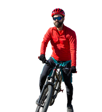 Cyclist riding bicycle on offroad against clear sky. A man in an outfit stands with a bicycle on an autumn sunny day.