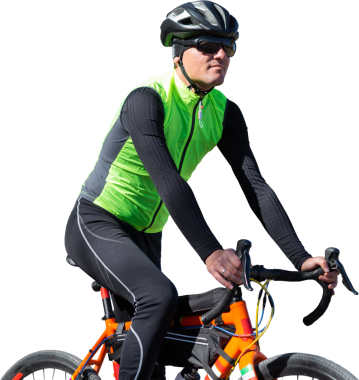 A man in clothes stands with a bicycle on an autumn sunny day. Cyclist in the park.