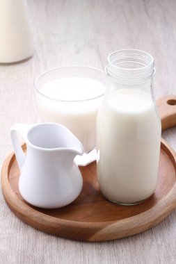 milk and jug of white and brown, rustic style, selective focus