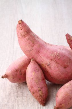fresh potato on a wooden background