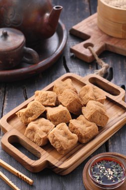 chinese traditional tea dumplings with cinnamon sticks and a cup of hot chocolate