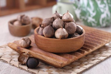 fresh figs in a bowl on wooden background