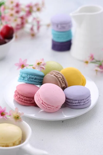 colorful macaroons with pink and white macarons on a light background.