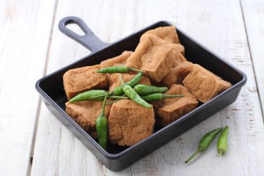 tasty sandwich with bread and vegetables on wooden background
