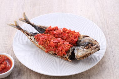 grilled fish with tomato sauce and spices