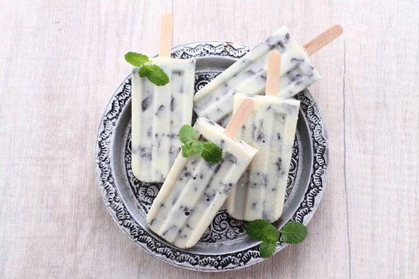 homemade ice cream with mint and green leaves
