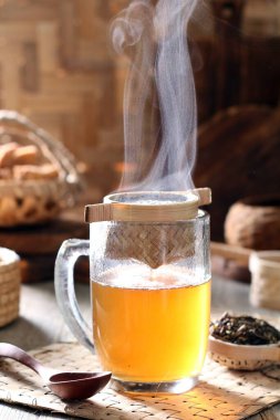 hot tea with a cup of coffee and a glass of milk on a wooden background