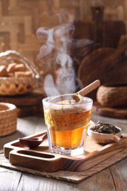 Tea is an aromatic beverage prepared by pouring hot or boiling water over cured or fresh leaves of Camellia sinensis, an evergreen shrub native to East Asia which probably originated in the borderlands of southwestern China and northern Myanmar.