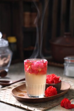 Coffee is a drink prepared from roasted coffee beans. Darkly colored, bitter, and slightly acidic, coffee has a stimulating effect on humans, primarily due to its caffeine content. It has the highest sales in the world market for hot drinks.